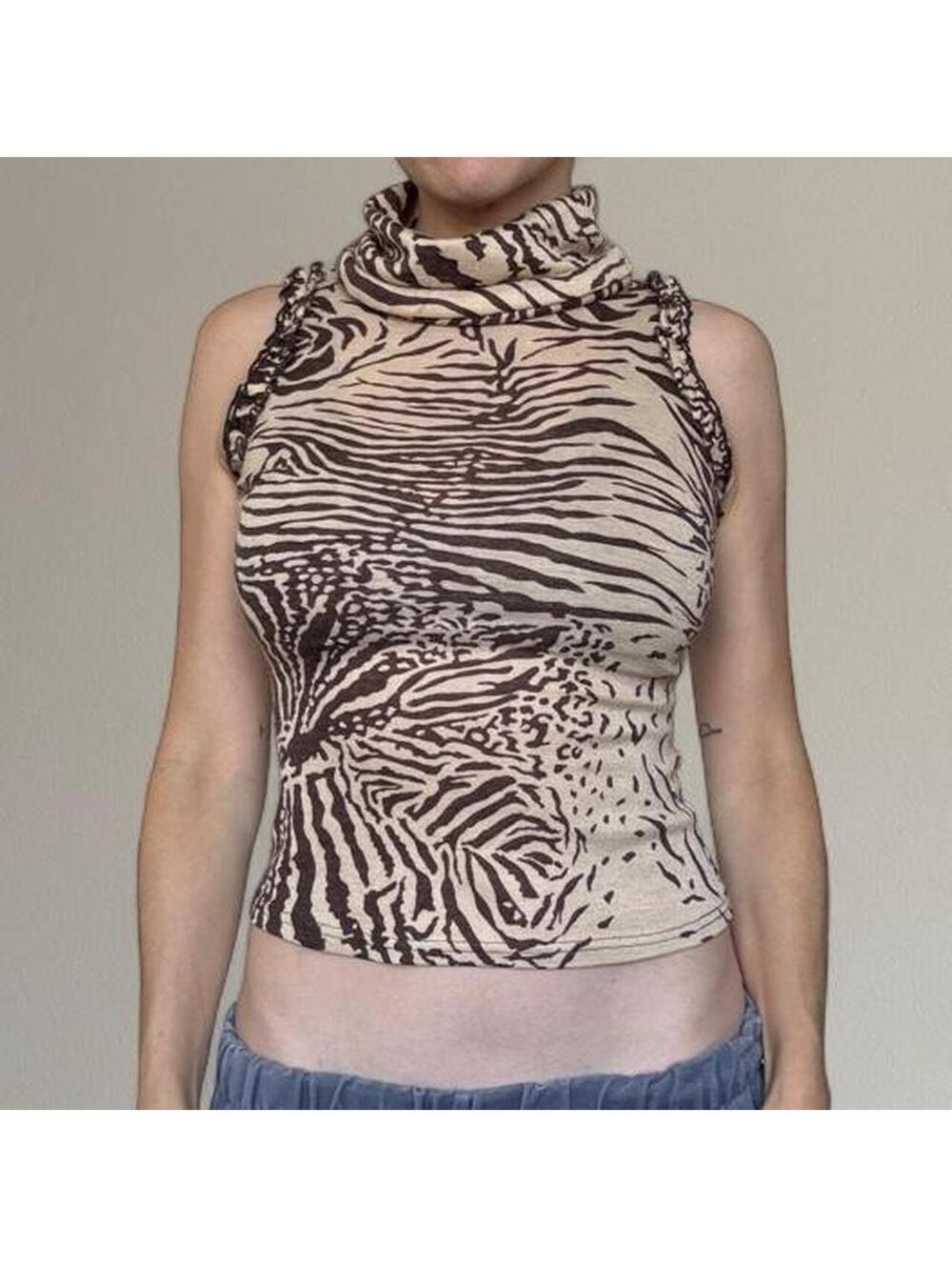 Animal print sleeveless turtleneck top. Best fits XS/S.